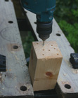 Drilling blocks of wood for a diy bee house